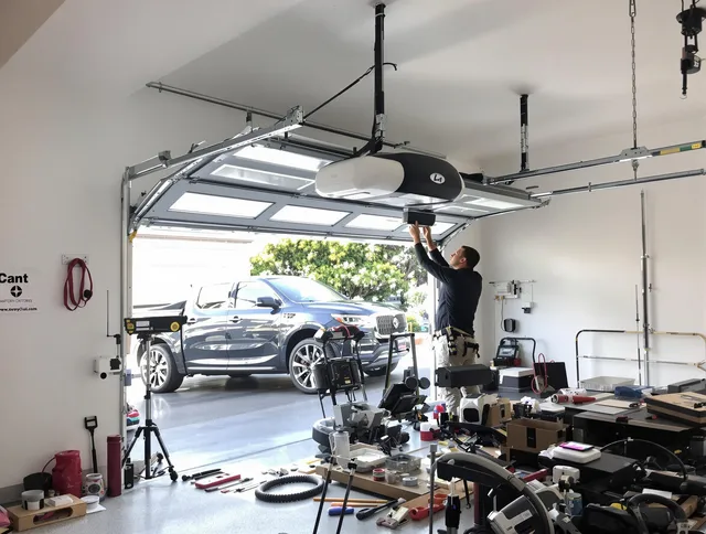Norton Garage Door Repair specialist installing smart garage door opener system in Norton home